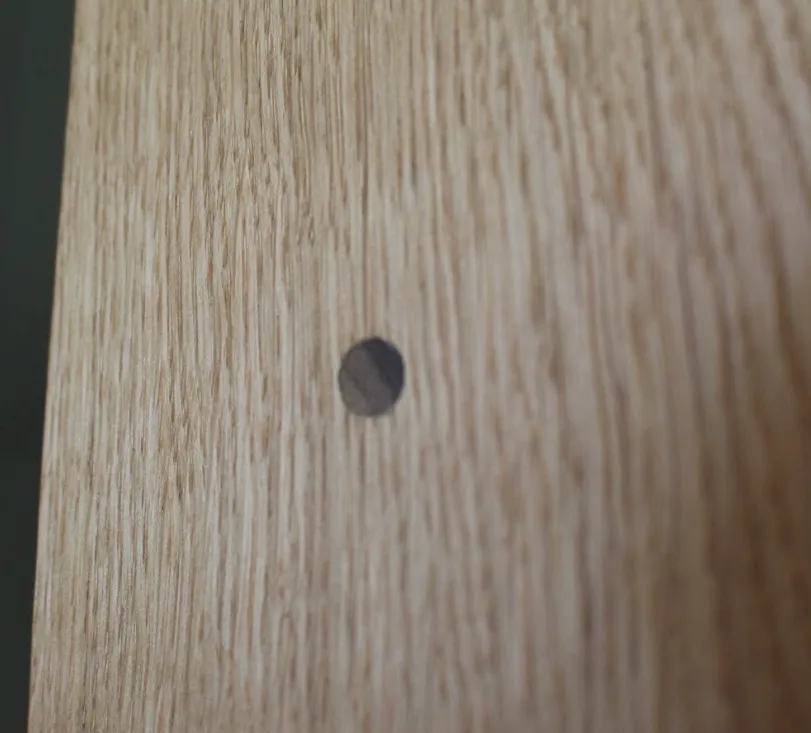 Firāq — walnut dowel on the oak side