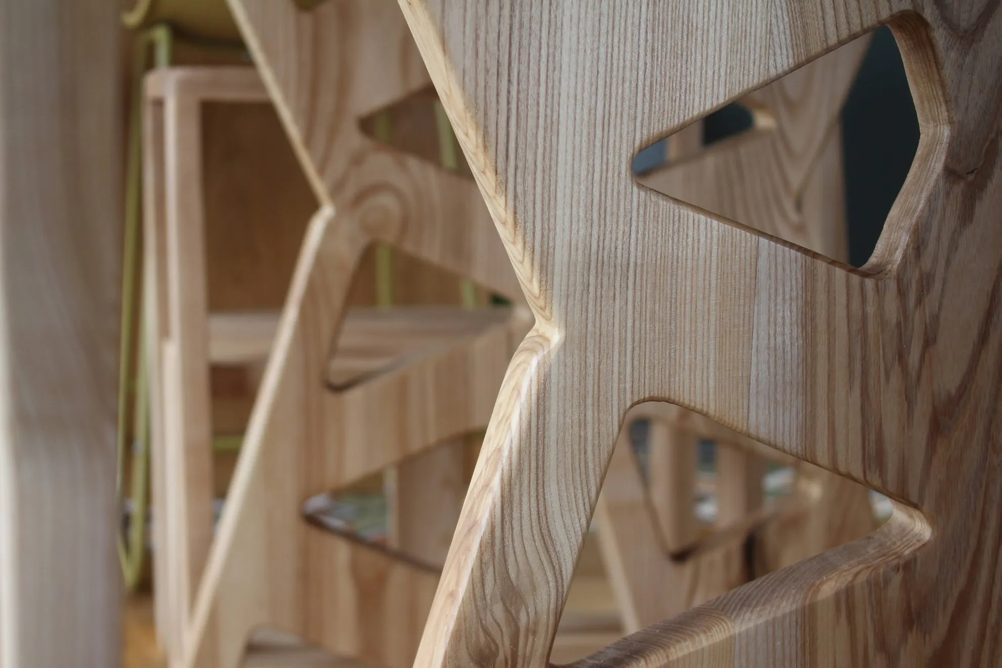Trinity — close-up of the openwork lattice in solid ash, rounded edges and grain